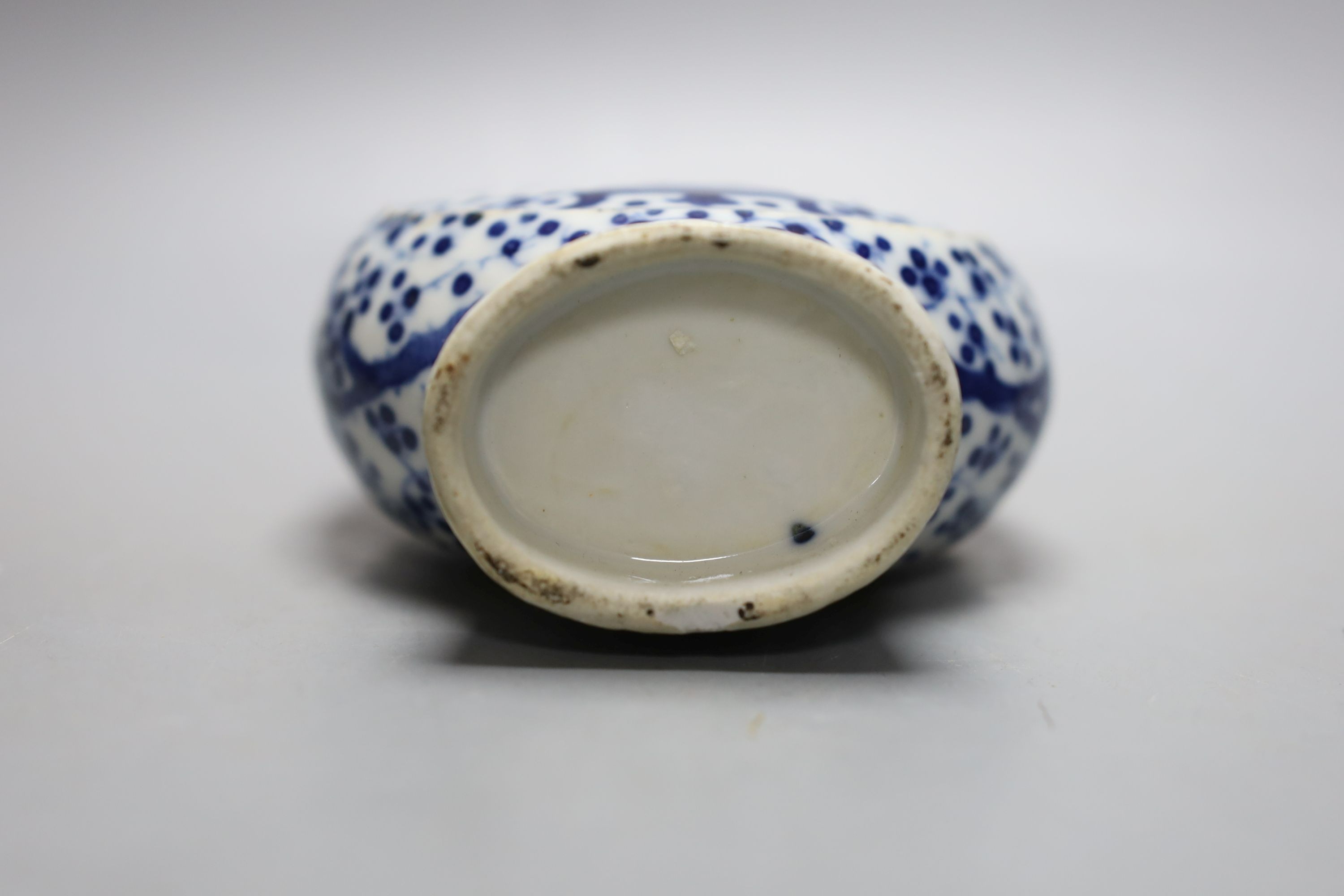 A pair of Chinese blue and white double gourd vases, similar moonflask and flower ornament 18cm